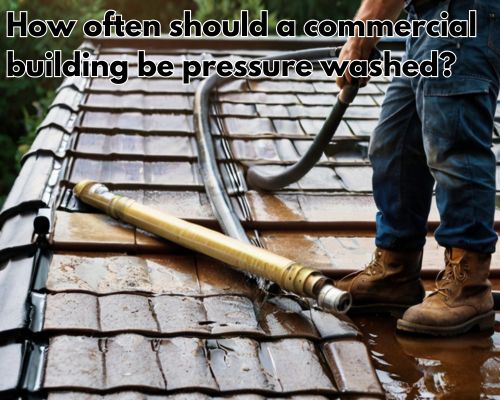 a commercial roof being pressure washed